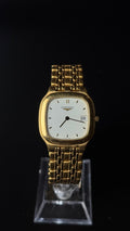 Longines – zegarek vintage z jasną tarczą i datownikiem na złotej bransolecie