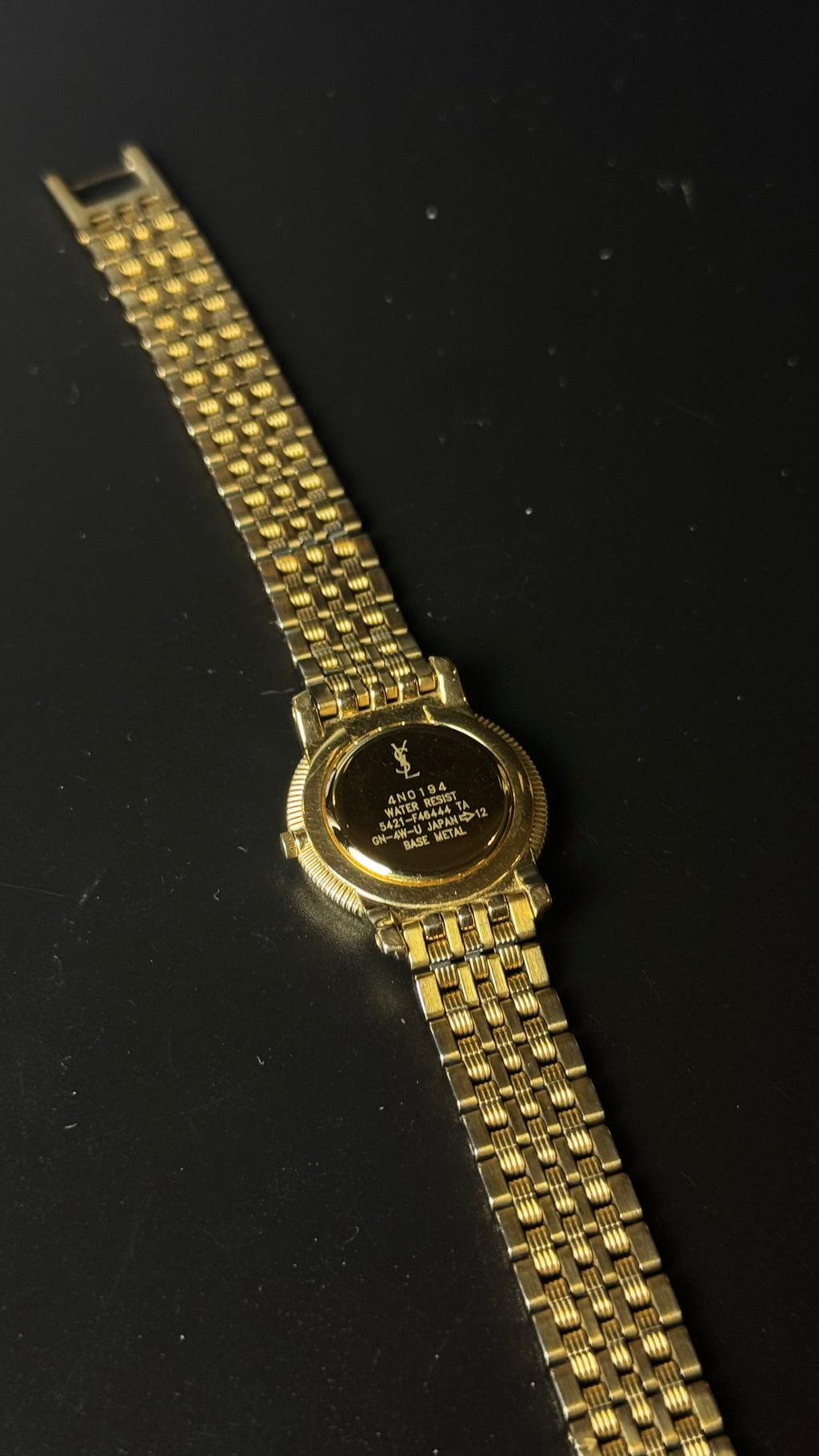 Yves Saint Laurent – zegarek vintage w złotym kolorze z rzymskimi cyframi i ozdobną bransoletą