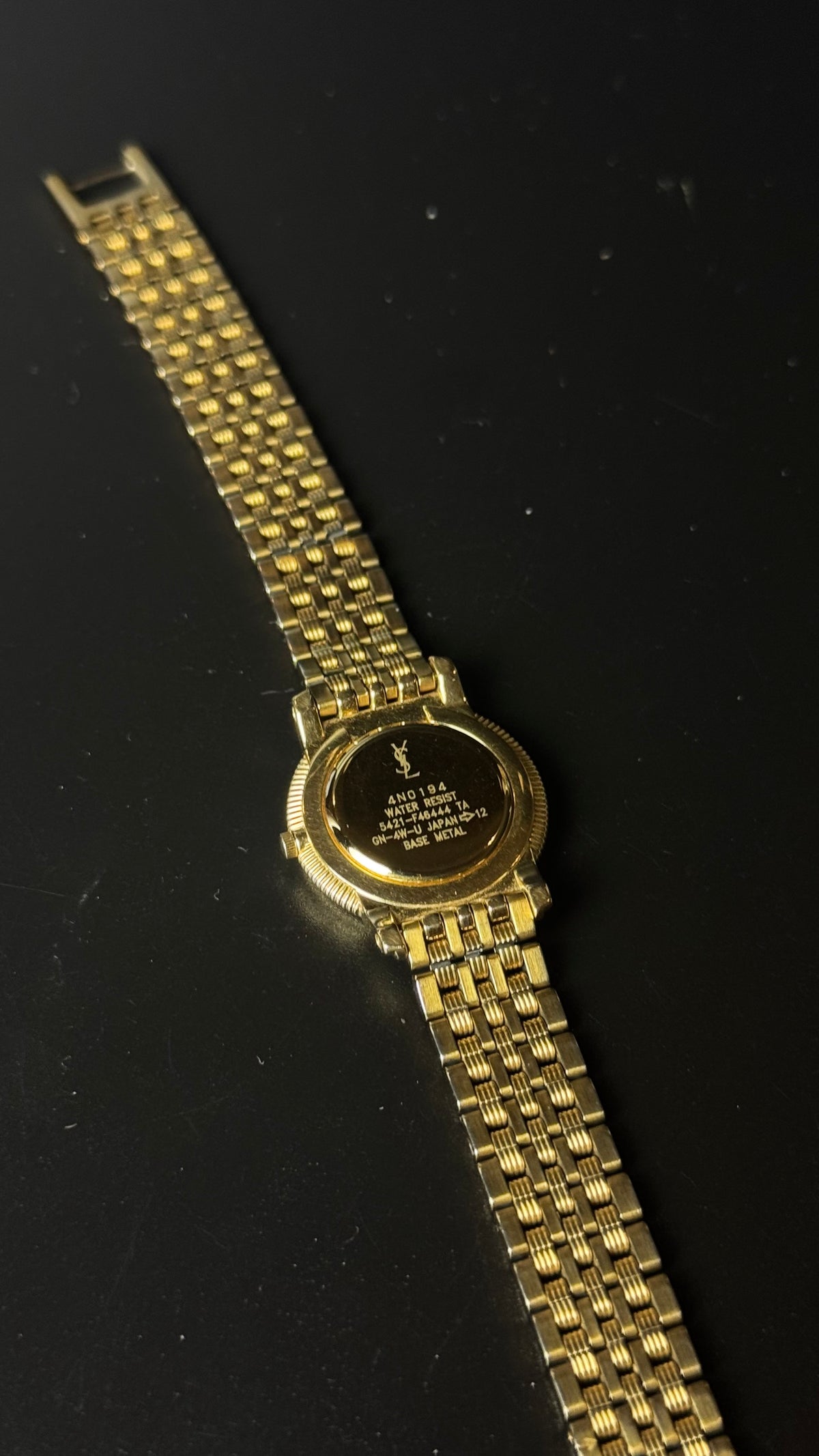 Yves Saint Laurent – zegarek vintage w złotym kolorze z rzymskimi cyframi i ozdobną bransoletą