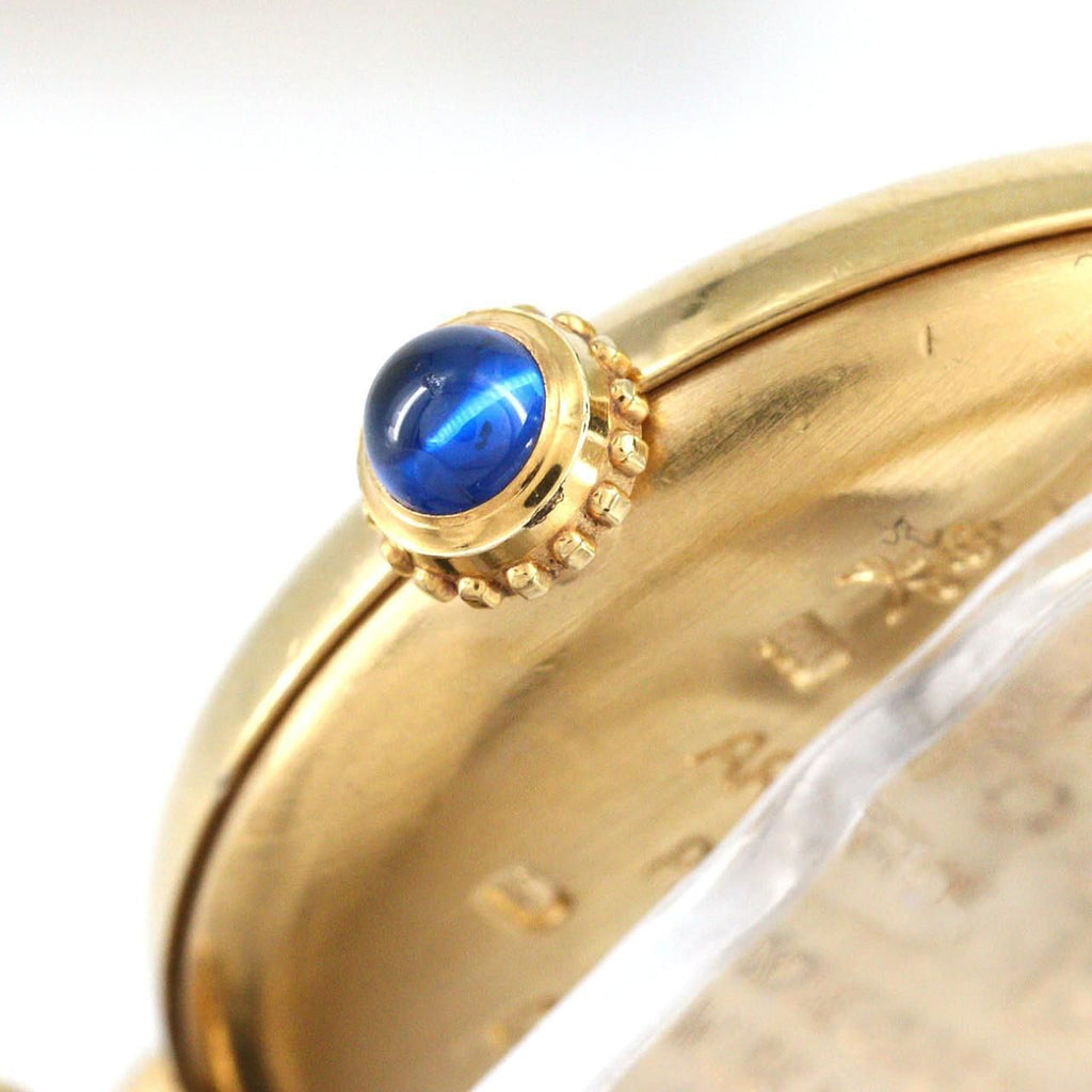 Cartier Must Colisée SM W1006654 – złocona koperta, czarny pasek