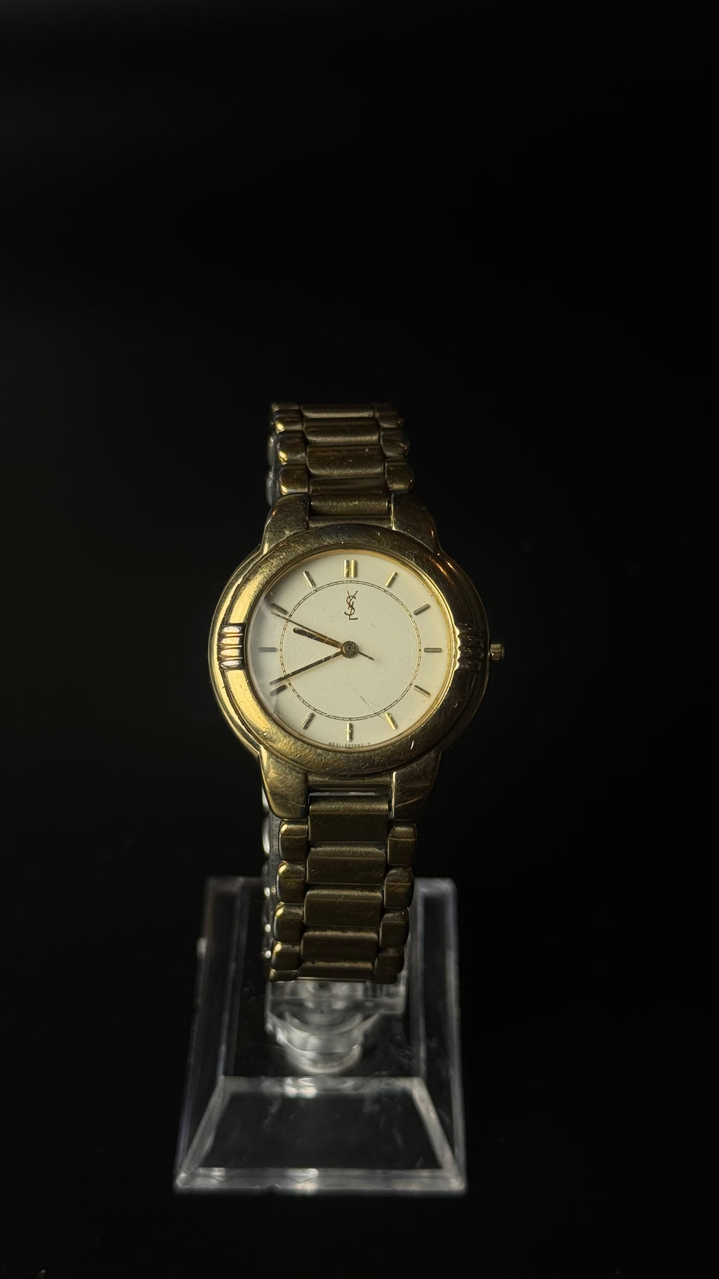 Yves Saint Laurent – zegarek vintage z kremową tarczą na złotej bransolecie