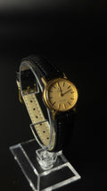 Omega De Ville – zegarek vintage ze złotą tarczą na czarnym pasku