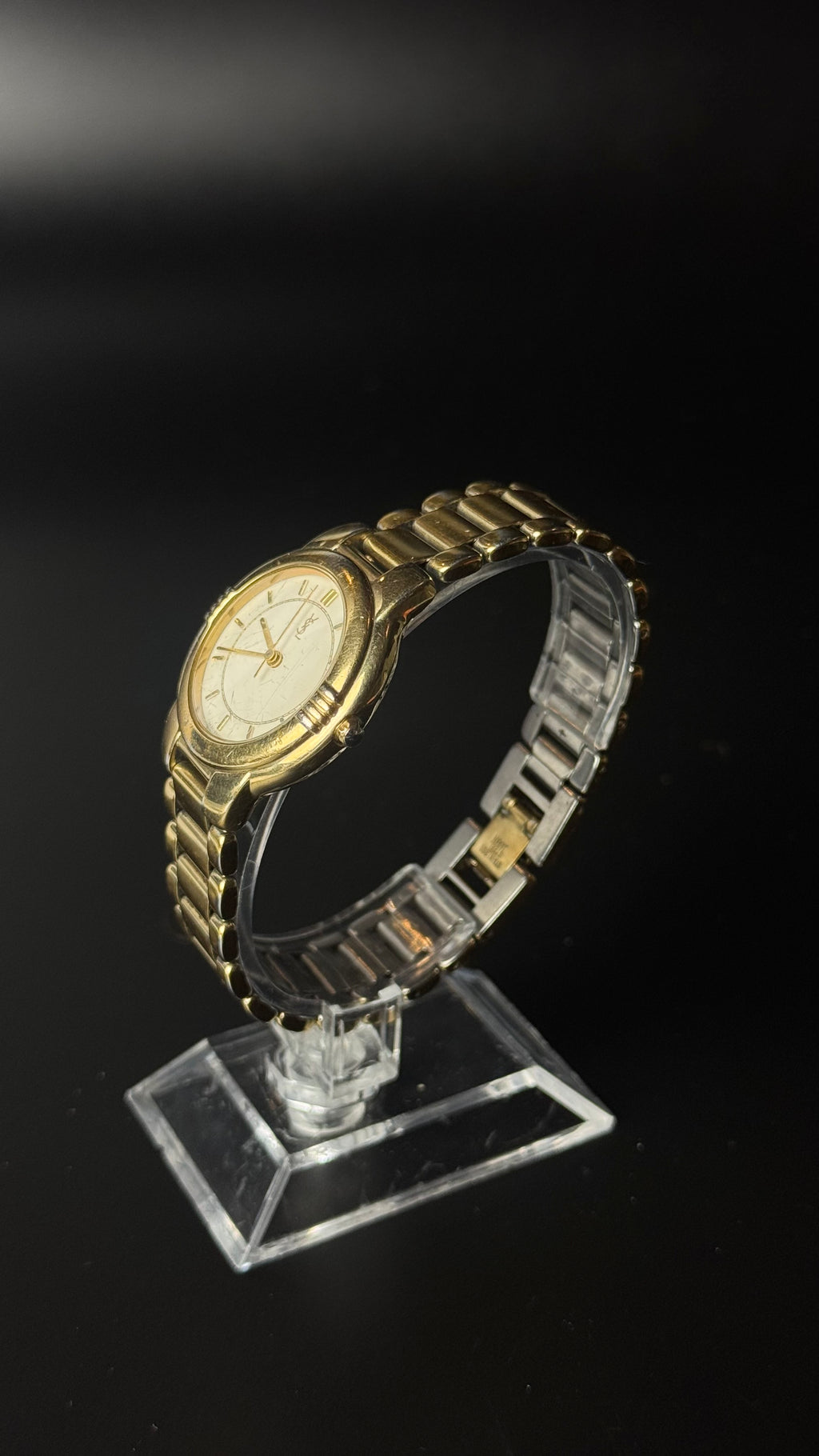 Yves Saint Laurent – zegarek vintage z kremową tarczą na złotej bransolecie
