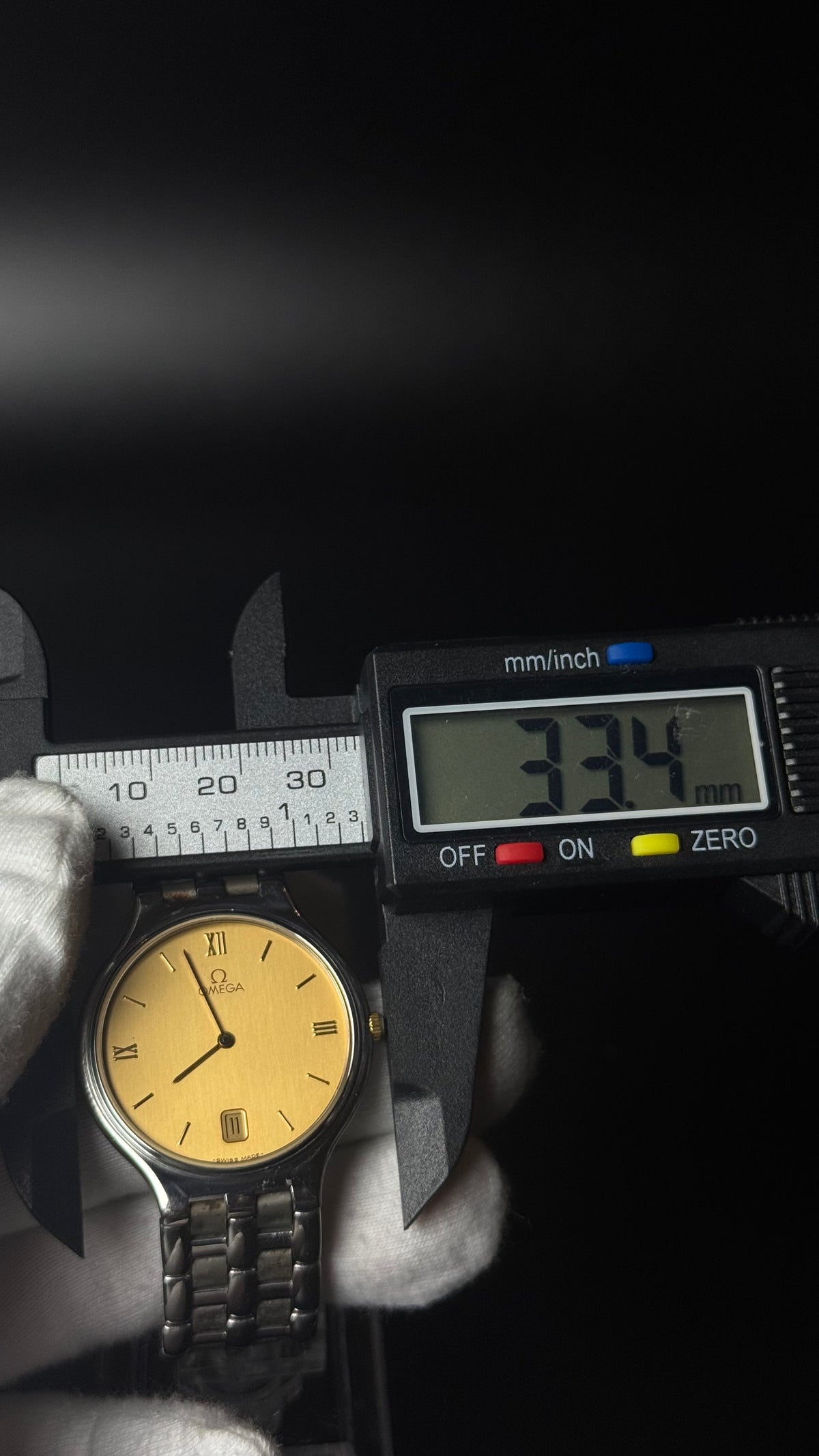 Omega – złota tarcza, srebrna bransoleta, datownik