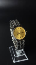 Omega – złota tarcza, srebrna bransoleta, datownik