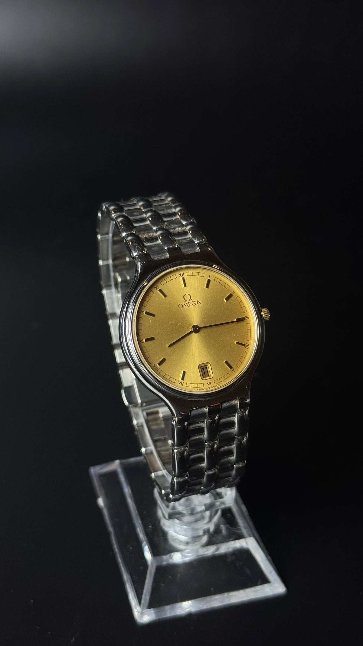 Omega – złota tarcza, srebrna bransoleta, datownik