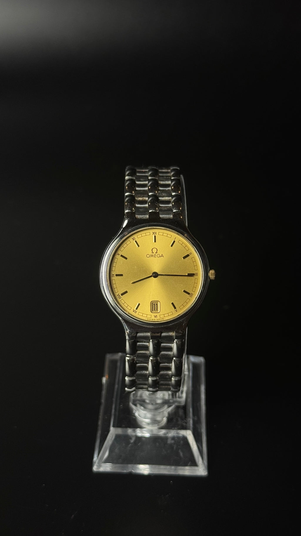 Omega – złota tarcza, srebrna bransoleta, datownik