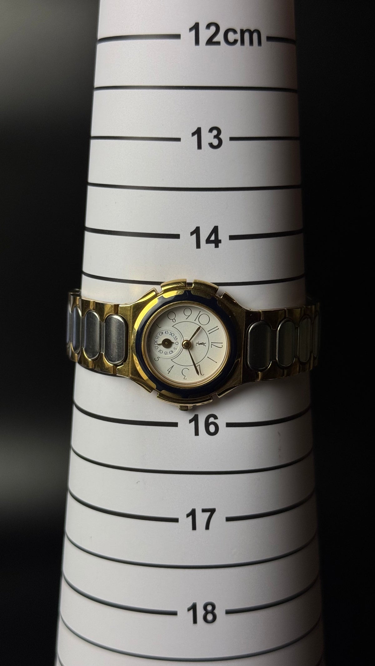 Yves Saint Laurent YSL – kremowa tarcza, granatowy bezel