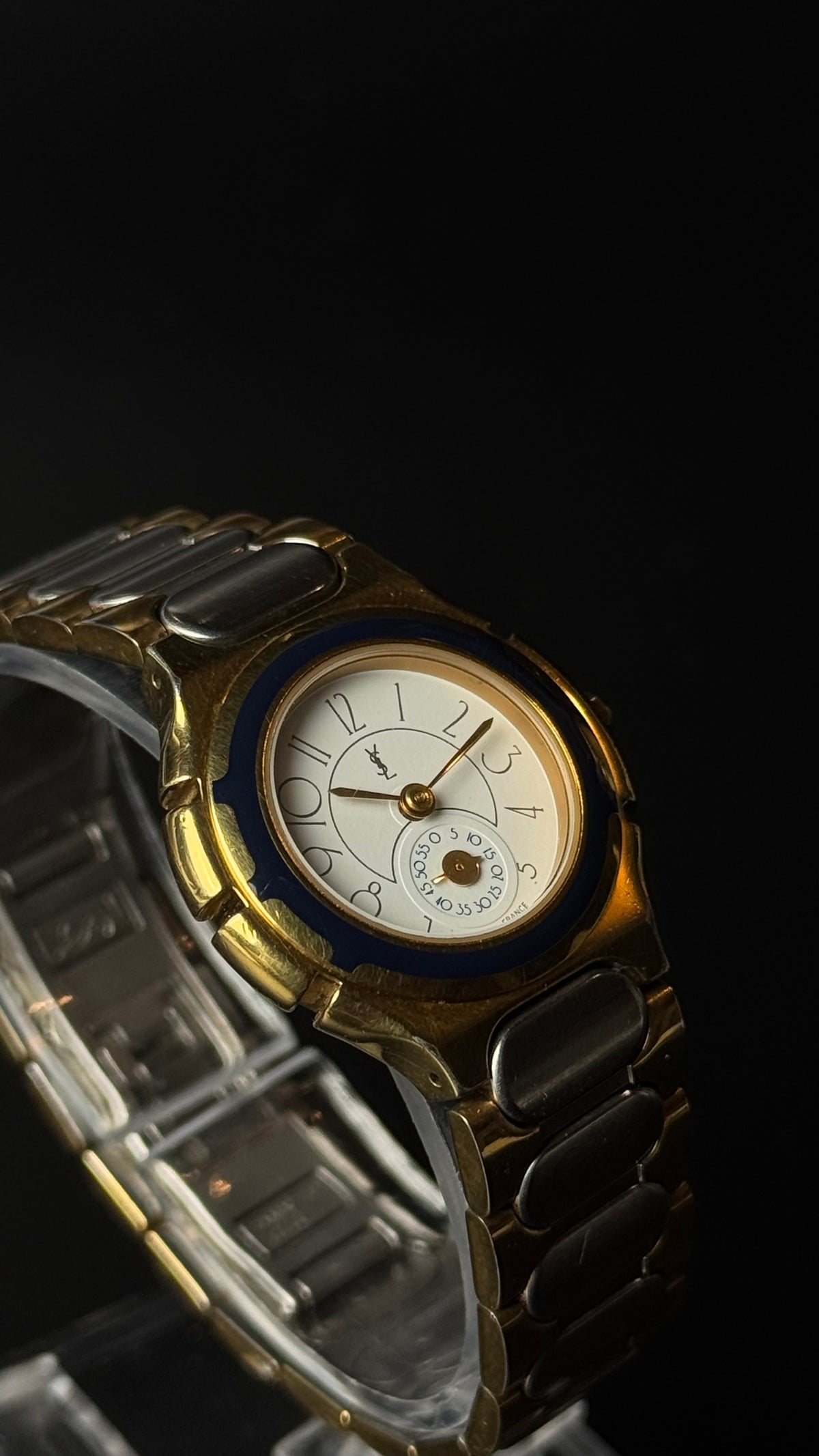 Yves Saint Laurent YSL – kremowa tarcza, granatowy bezel