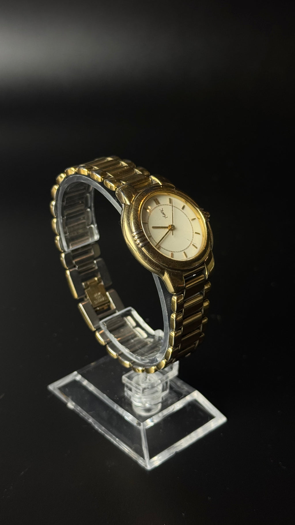 Yves Saint Laurent – zegarek vintage z kremową tarczą na złotej bransolecie